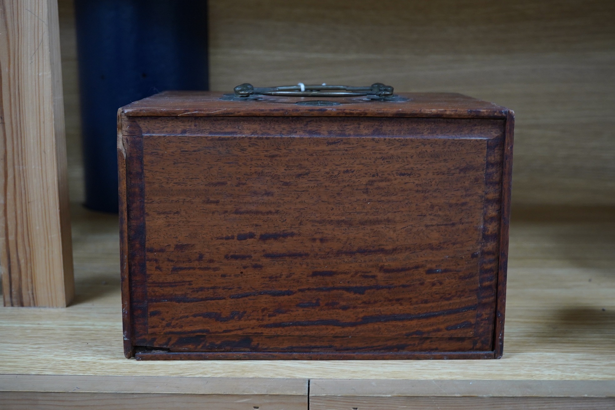 An early 20th century Chinese Mah Jong set, with bone tiles, 22cm x 15.5cm x 14.5cm. Condition - fair, one drawer front replaced